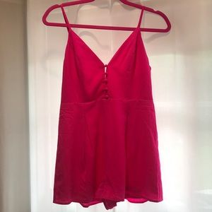 Bright pink button romper from boutique